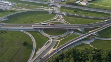 Aerial view of cars driving on round intersection in city, Transportation roundabout infrastructure, Highway road junction in Wroclaw, Poland