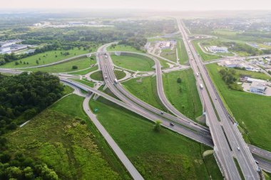 Aerial view of cars driving on round intersection in city, Transportation roundabout infrastructure, Highway road junction in Wroclaw, Poland