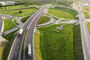 Aerial view of cars driving on round intersection in city, Transportation roundabout infrastructure, Highway road junction in Wroclaw, Poland