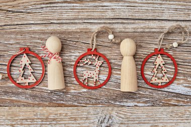 Christmas composition withhandmade toys on wooden background, flat lay