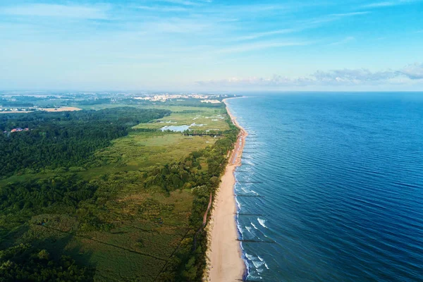 Drone aerial view of sea coastline landscape with sand beach and park,Baltic sea coastline in Poland