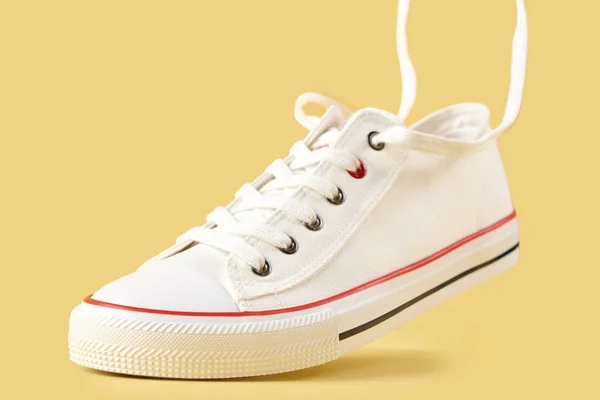White Female Sport Sneakers Flying Shoe Lace Yellow Background Casual — 스톡 사진