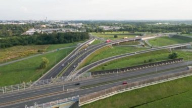 Aerial view of cars driving on round intersection in city, Transportation roundabout infrastructure, Highway road junction in Wroclaw, Poland