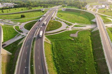 Aerial view of cars driving on round intersection in city, Transportation roundabout infrastructure, Highway road junction in Wroclaw, Poland