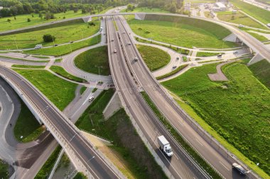 Aerial view of cars driving on round intersection in city, Transportation roundabout infrastructure, Highway road junction in Wroclaw, Poland
