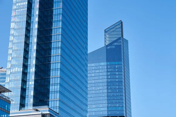 Administrative center in Warsaw, Business office buildings in downtown central district, Skyscrapers with glass facade against blue sky