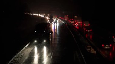 Car accident on slippery road at night during snowfall, Dangerous driving during winter snowstorm