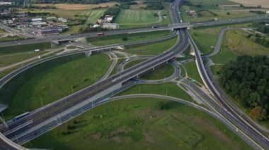 Aerial view of cars driving on round intersection in city, Transportation roundabout infrastructure, Highway road junction in Wroclaw, Poland