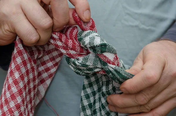Two Men Hands Tie Two Towels Together Knotted Red Green — Stock Photo, Image