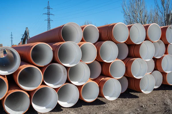 Stack New Orange Polypropylene Pipes Plastic Pipes Laying Gutter Industrial — Stock Photo, Image