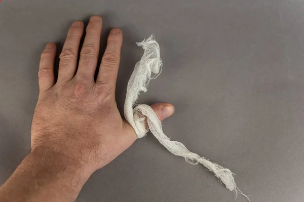 Hand Mature Man Piece White Bandage Gray Background Health Medicine —  Fotos de Stock