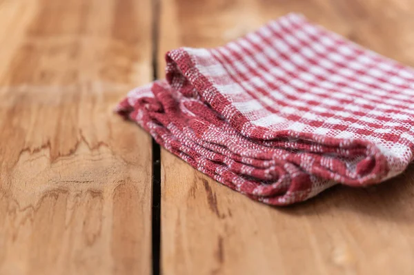 Red Plaid Kitchen Towel Lies Countertop Wooden Table Crumpled Towel — Stok Foto