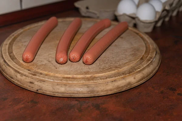 Sausages Polyamide Casings Four Sausages Lie Cutting Board Wooden Cutting — 스톡 사진