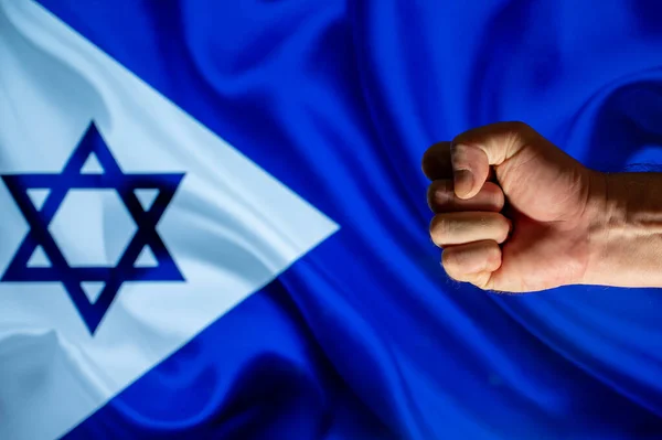 Male Hand Clenched Fist Blue Flag Background Israeli Navy Flag — ストック写真