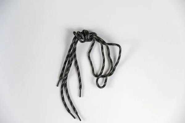 Lanyard Neutral Background Gray Black Lace Knot Tied Close Selective — Stok fotoğraf