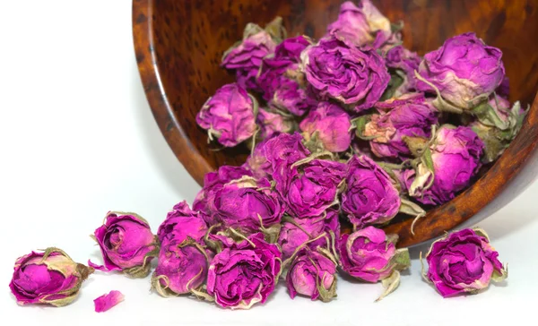Wellness-Konzept mit getrockneten rosa und lila Rosenknospen. — Stockfoto