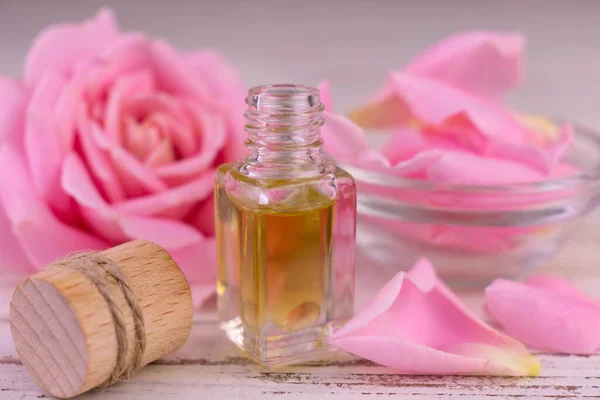Natural Peony Essential Oil In A Glass Bottle Splash With Pink Flowers On  White Background, Organic Fresh Extracts Arom , AI Generative Stock Photo,  Picture and Royalty Free Image. Image 201340073.