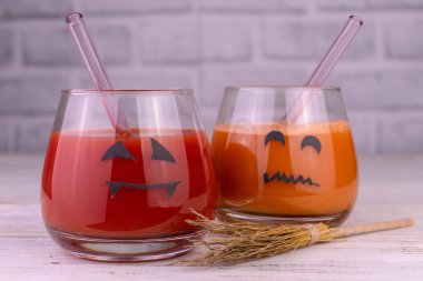 Halloween drink idea. Freak Monster cocktail. Jack O'Lantern's face on the glass.