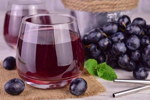 Grape juice in a glass. Fresh grape juice. Close-up.