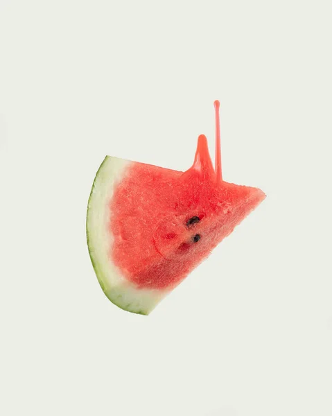 Red Juice Oozes Upwards Triangular Juicy Slice Fresh Watermelon Floating — стоковое фото
