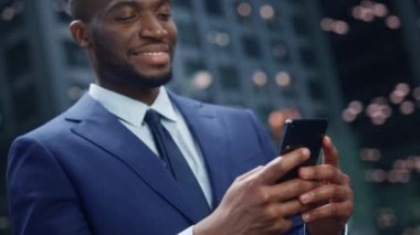 Businessman Using Smarthphone on Street