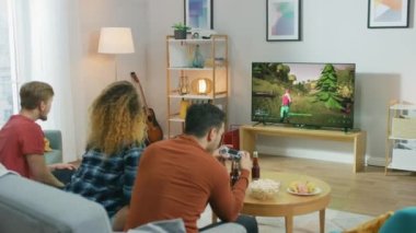 Friends Playing Video Game On Console