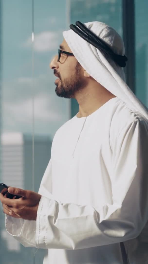 Vertical Screen Saudi Emirati Arab Businessman Using Smartphone — Stockvideo