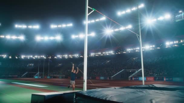 Man Pole Vault Jump Over Bar with Spectators — Video