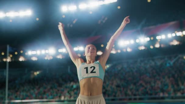 Female Athlete Celebrating Victory With Spectators — Vídeo de Stock