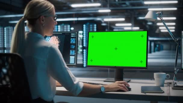 Specialist Working on Green Screen Computer in Data Center — Stock Video