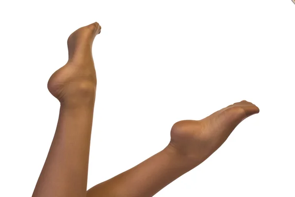 Ноги в панчохах і високі підбори ізольовані на білому — стокове фото