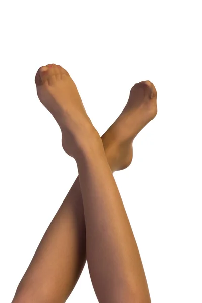 Τα πόδια σε κάλτσες και τα ψηλά τακούνια που απομονώνονται σε λευκό — Φωτογραφία Αρχείου