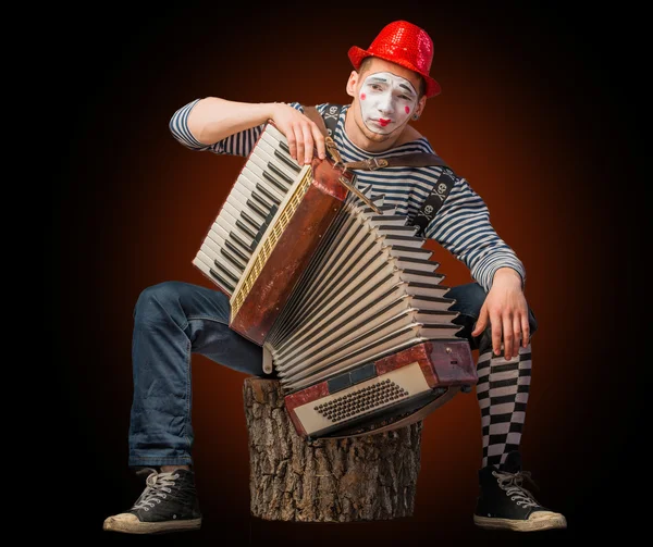 Clown playing on accordion — Stock Photo, Image