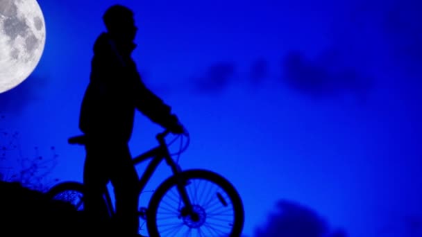 Bicycle night rider goes home in moonlight — Stock Video