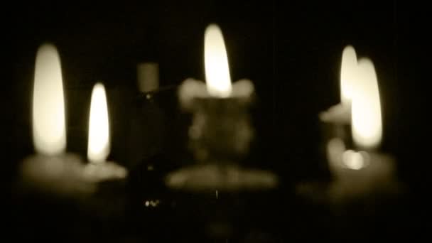 Candles in candelabrum with five branches in full dark — Stock Video