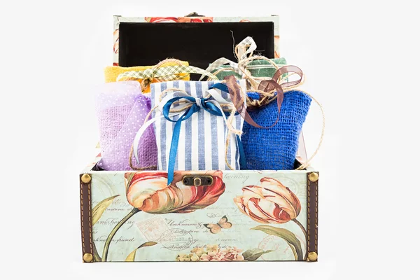 Gift box with decorative textile pouches — Stock Photo, Image