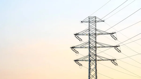 One single tall high voltage electricity pylon, transmission tower, clear sky, background, copy space, wide banner, nobody. Power generation industry, electricity supply, power grid concept, no people