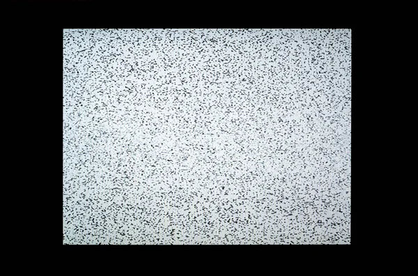 Classic black white blank modern LCD TV screen static noise, no signal, interrupted broadcast, nothing on screen. Rectangle display in a dark room, front view, frontal shot, closeup, nobody, no people
