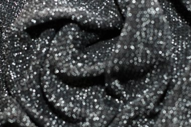 Parlak lurex kumaş dokusu gümüş ve siyah renk.