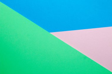 Renkli kağıt mavisi ile pembe ve yeşil renkli soyut arkaplan.