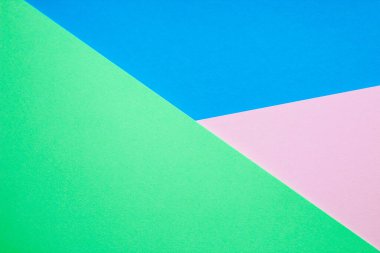 Renkli kağıt mavisi ile pembe ve yeşil renkli soyut arkaplan.