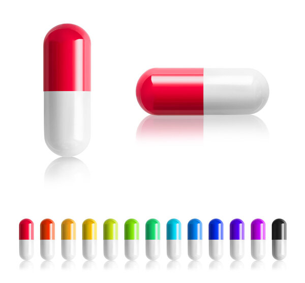 Цветные таблетки изолированы на белом фоне
