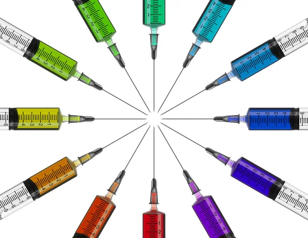 Syringes in a circle with colored liquid — Stock Photo, Image