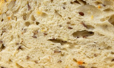 Susamlı ekmek hamuru, keten ve ayçiçeği tohumları, baharatlar, yakın çekim makro.