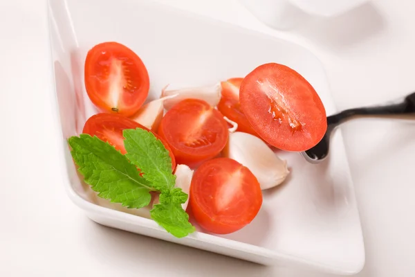 Tomato in a bowl — Stock Photo, Image