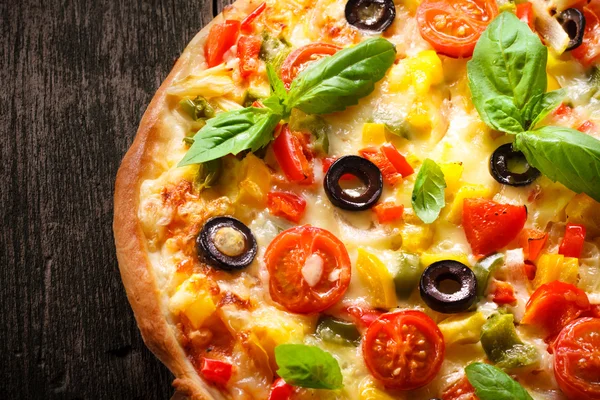 Pizza on wood texture background — Stock Photo, Image