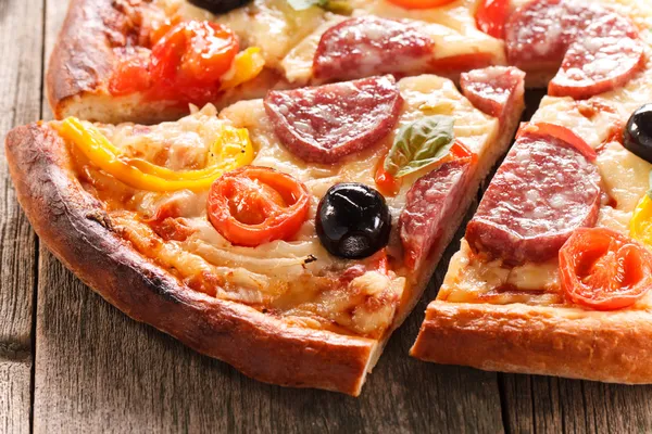 Pizza on wood texture background — Stock Photo, Image