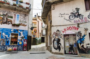 ORGOSOLO, SARDINIA, ITALY - APRIL 16: Street murals, Folk Art in clipart