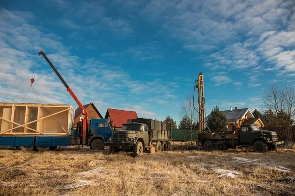 The drilling rig is drilling a well for water. Water extraction on a private plot of land.