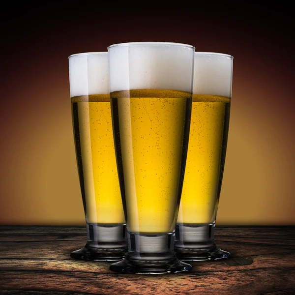 Cold beer glass on wood table — Stock Photo, Image